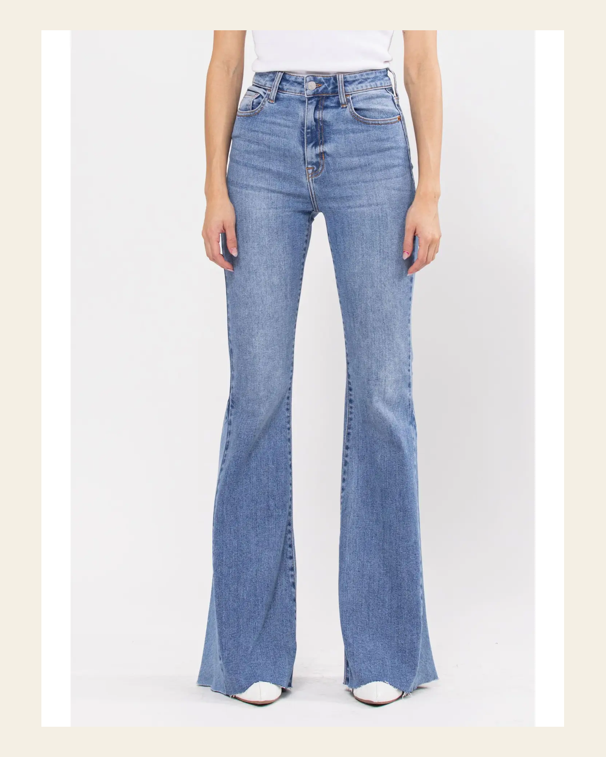 Paloma Super Flare Denim | Jeans on a warm cream background