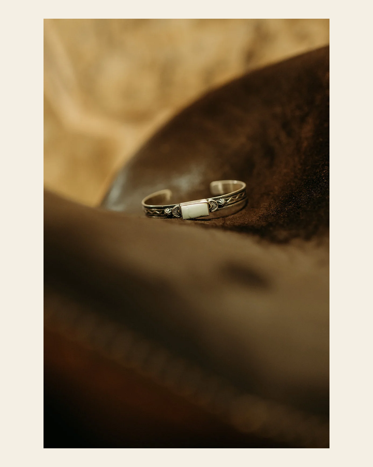 Palomino Turquoise Cuff Bracelet By Francis Yazzie on a warm cream background