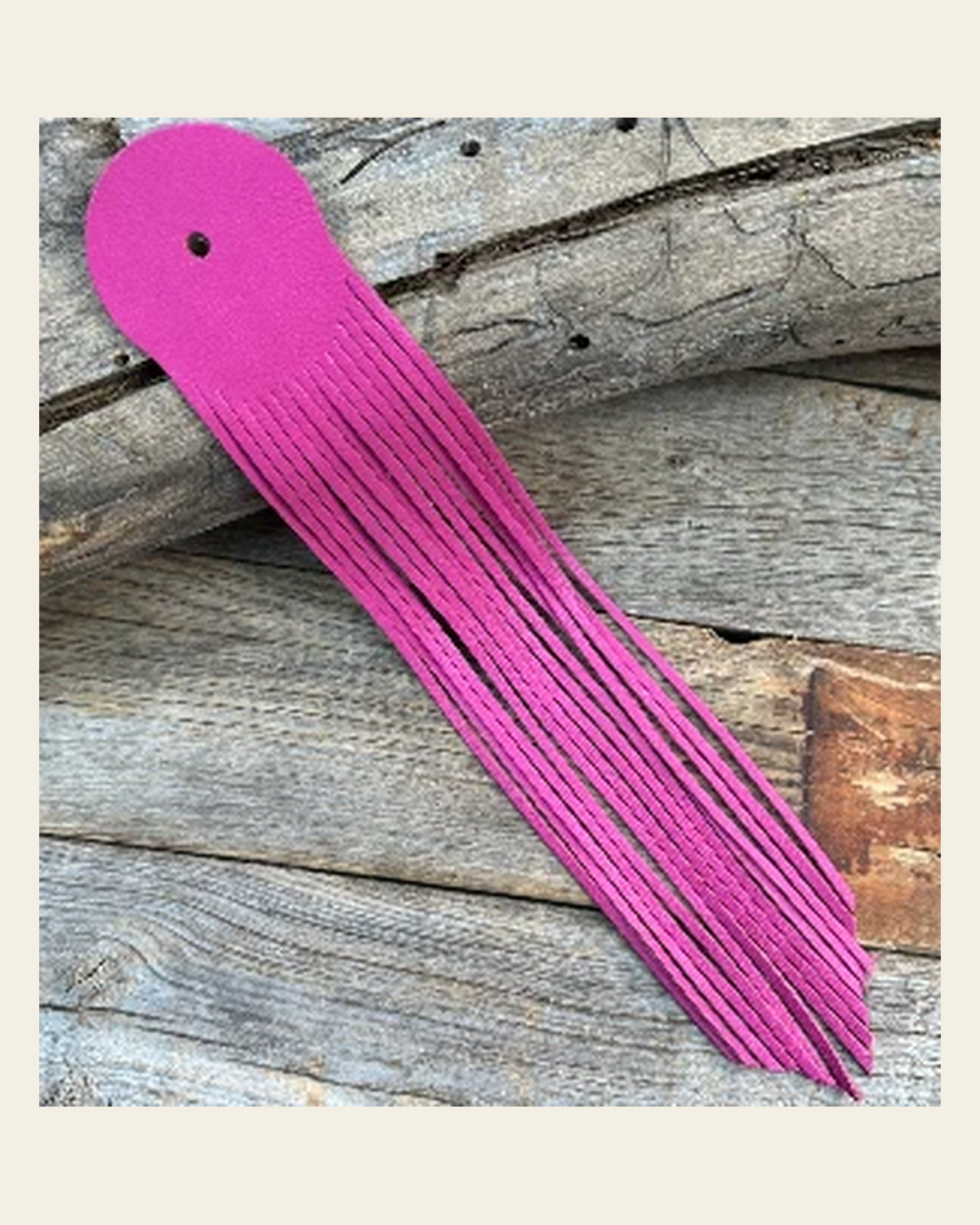 Pink Leather Fringe on a warm cream background