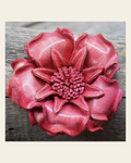 Pink Gardenia Leather Flower on a warm cream background