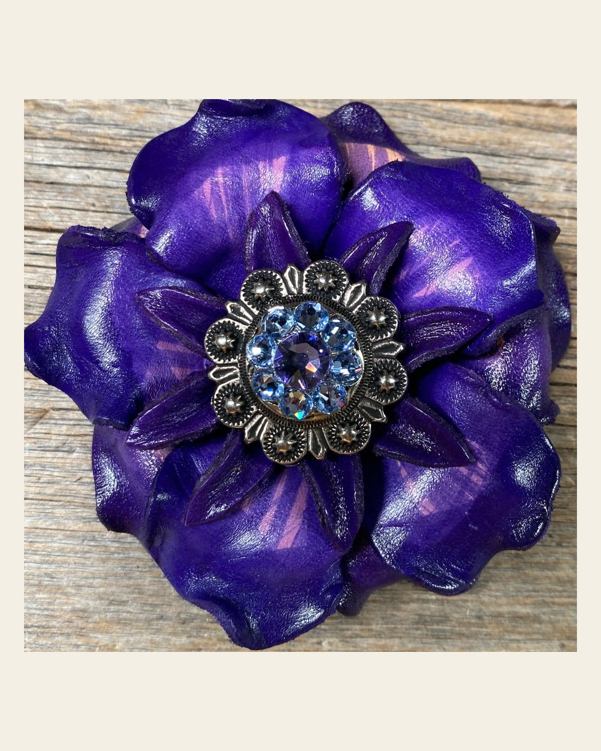 Purple Gardenia Flower With Antique Silver Lilac & Light Sapphire 1" Concho on a warm cream background