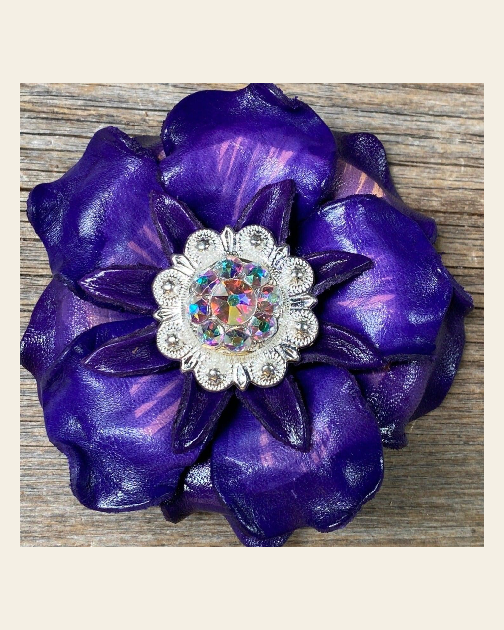 Purple Gardenia Flower With Bright Silver AB 1" Concho on a warm cream background