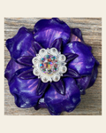 Purple Gardenia Flower With Bright Silver AB 1" Concho on a warm cream background