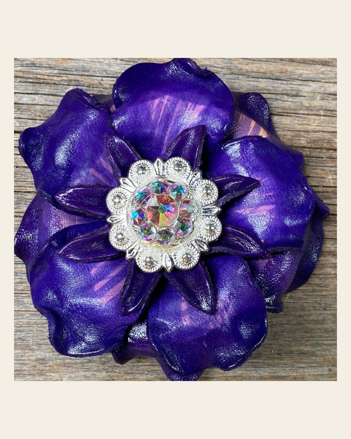 Purple Gardenia Flower With Bright Silver AB 1" Concho on a warm cream background