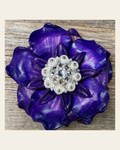 Purple Gardenia Flower With Bright Silver Clear 1" Concho on a warm cream background