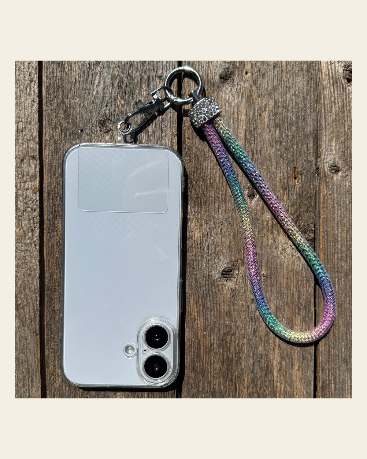 Rainbow Rhinestone Cell Phone Wristlet #CPW103 on a warm cream background