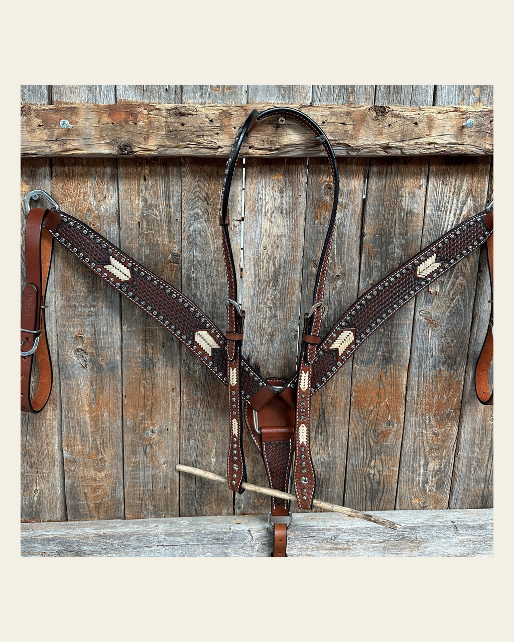 Rawhide One Ear/ Breastcollar Tack Set on a warm cream background