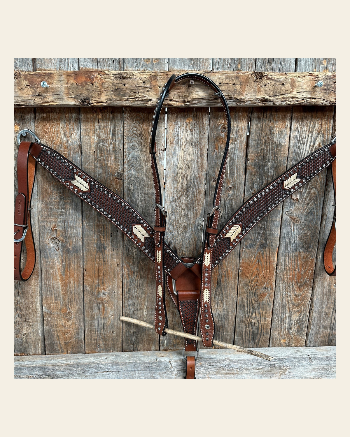 Rawhide One Ear/ Breastcollar Tack Set on a warm cream background