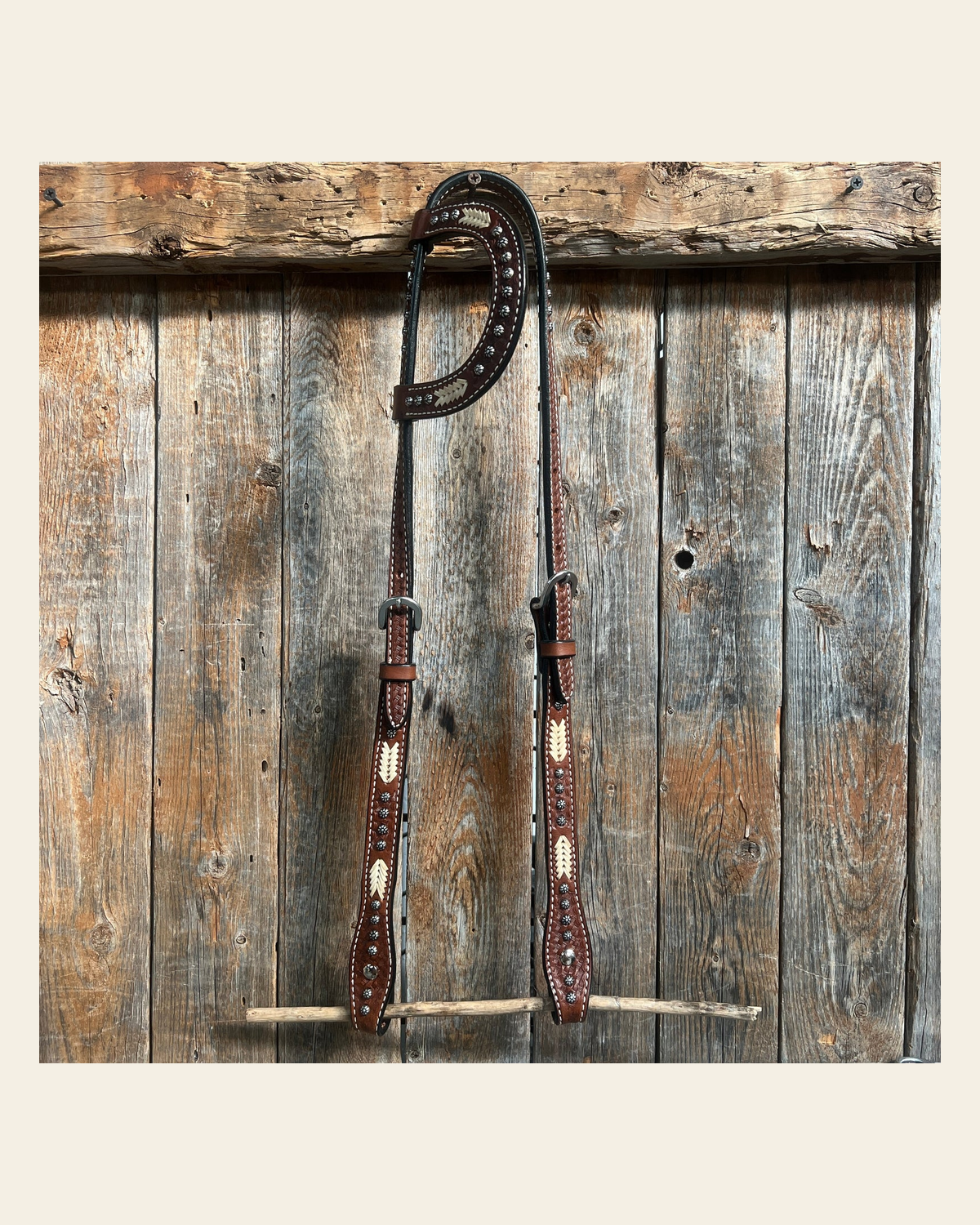 Rawhide One Ear Headstall / Bridle on a warm cream background