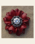 Red Carnation Flower With Antique Silver Clear 1" Concho on a warm cream background