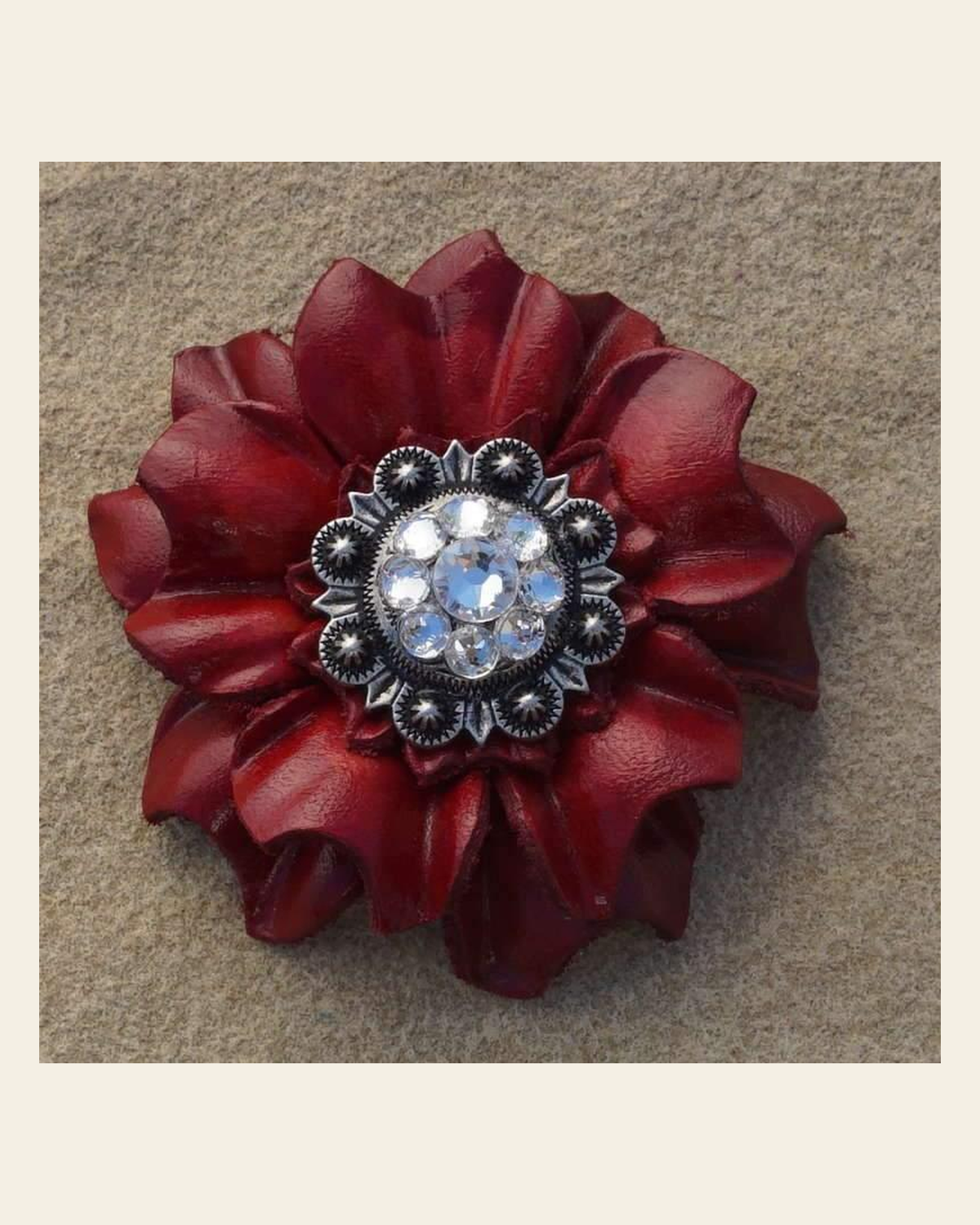 Red Carnation Flower With Antique Silver Clear 1" Concho on a warm cream background