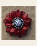 Red Carnation Flower With Antique Silver Light Sapphire and AB 1" Concho on a warm cream background
