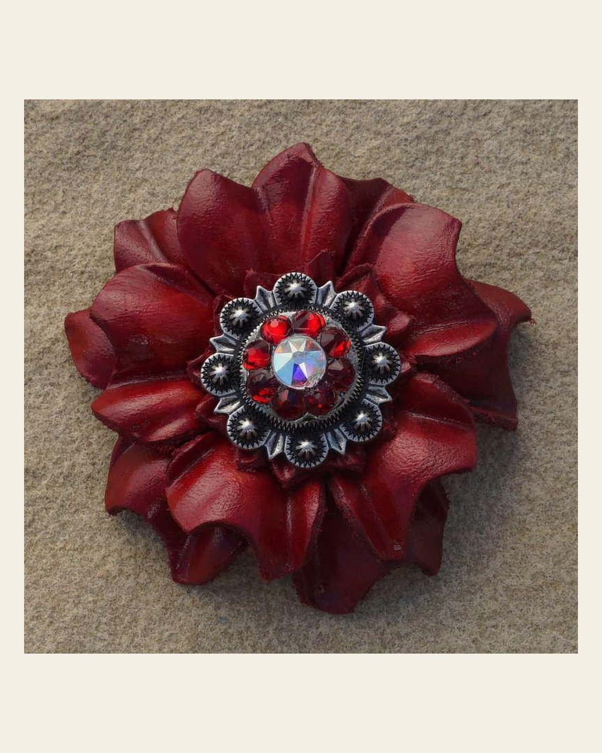 Red Carnation Flower With Antique Silver Ruby and AB 1" Concho on a warm cream background