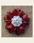 Red Carnation Flower With Bright Silver Clear 1" Concho on a warm cream background