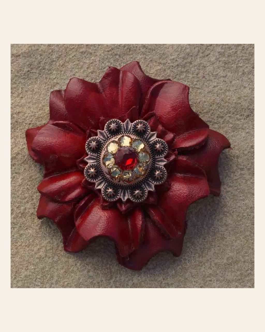 Red Carnation Flower With Copper Ruby & Champagne 1" Concho on a warm cream background