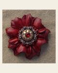Red Carnation Flower With Copper Ruby & Champagne 1" Concho on a warm cream background