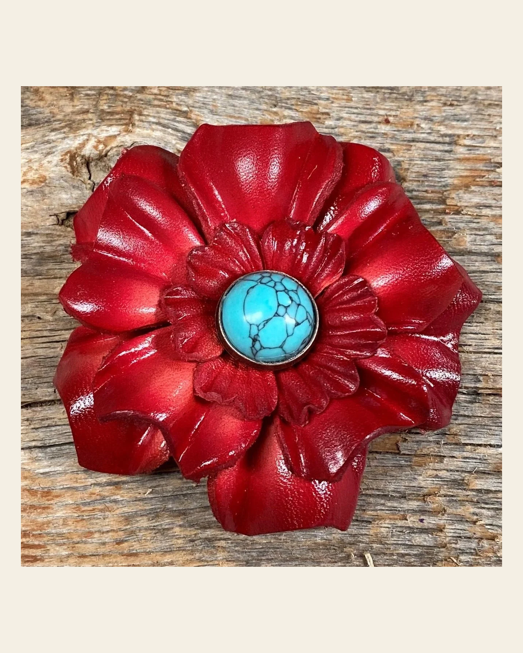 Red Carnation Flower With Round Turquoise Cabochon on a warm cream background