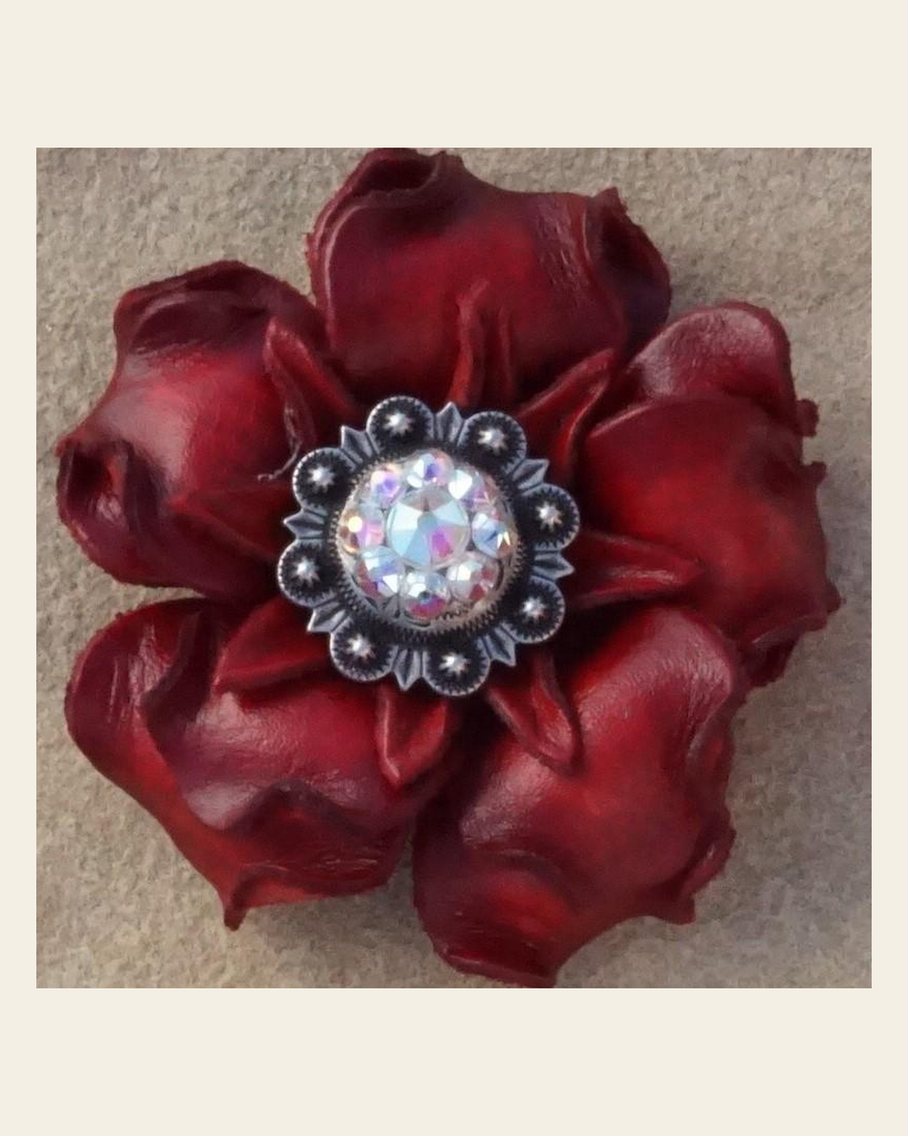 Red Gardenia Flower With Antique Silver AB 1" Concho on a warm cream background