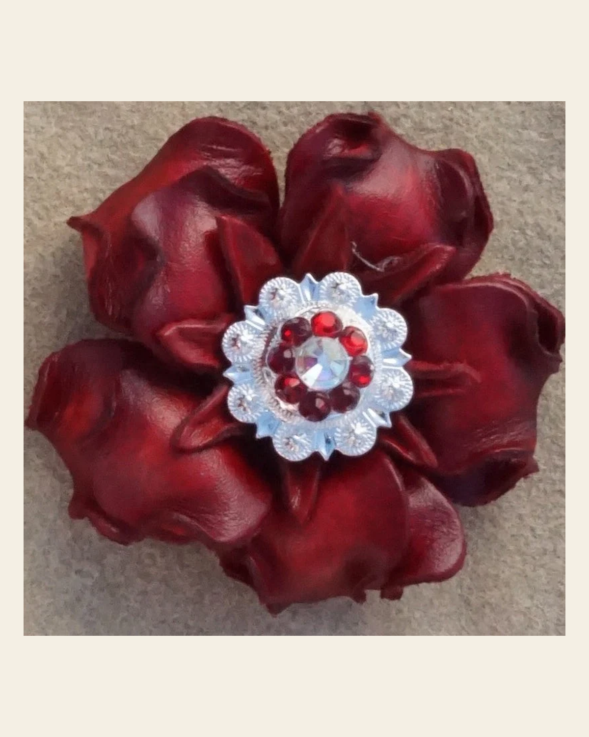 Red Gardenia Flower With Bright Silver Red & AB 1" Concho on a warm cream background