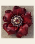 Red Gardenia Flower With Copper Ruby & Champagne 1" Concho on a warm cream background