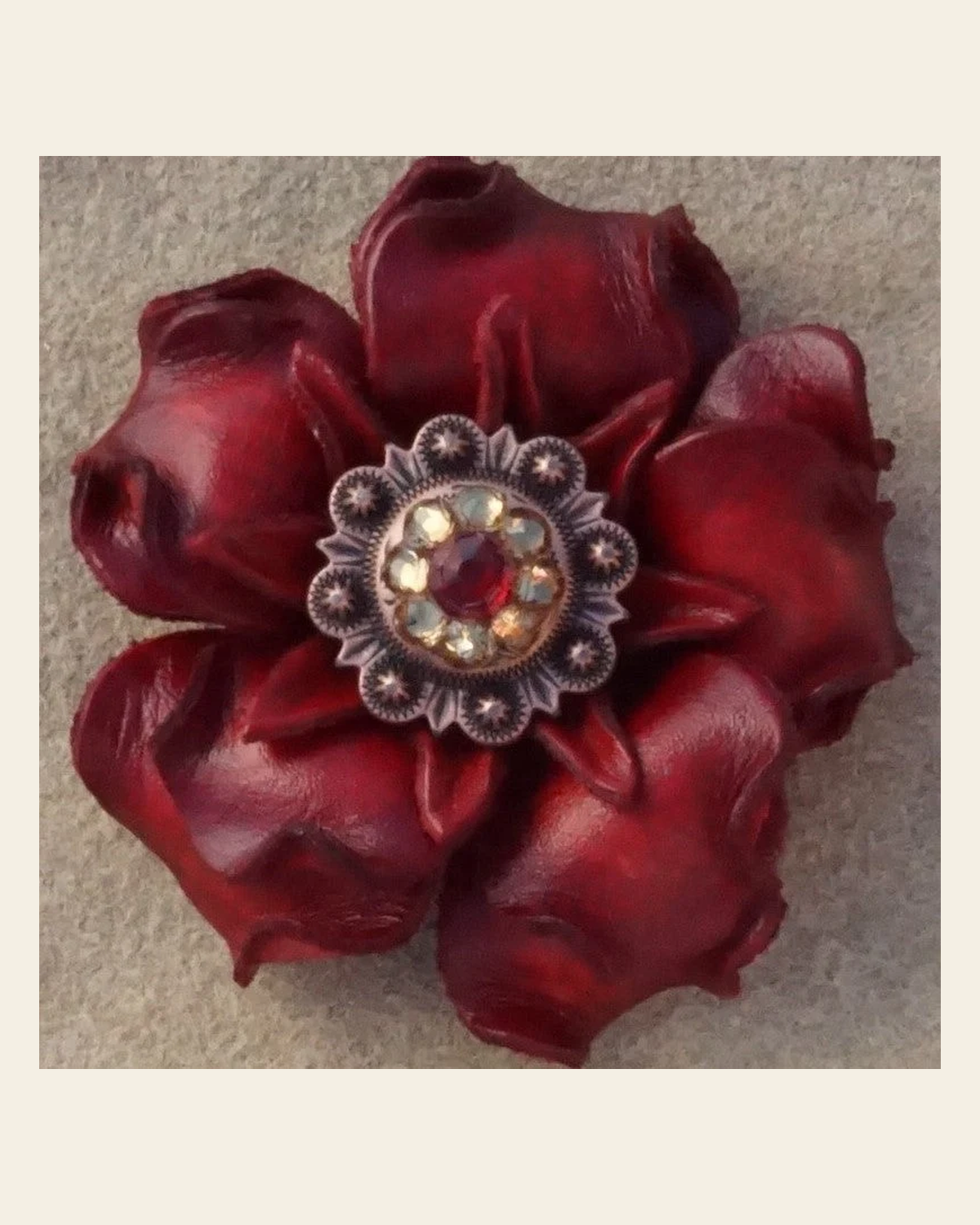 Red Gardenia Flower With Copper Ruby & Champagne 1" Concho on a warm cream background