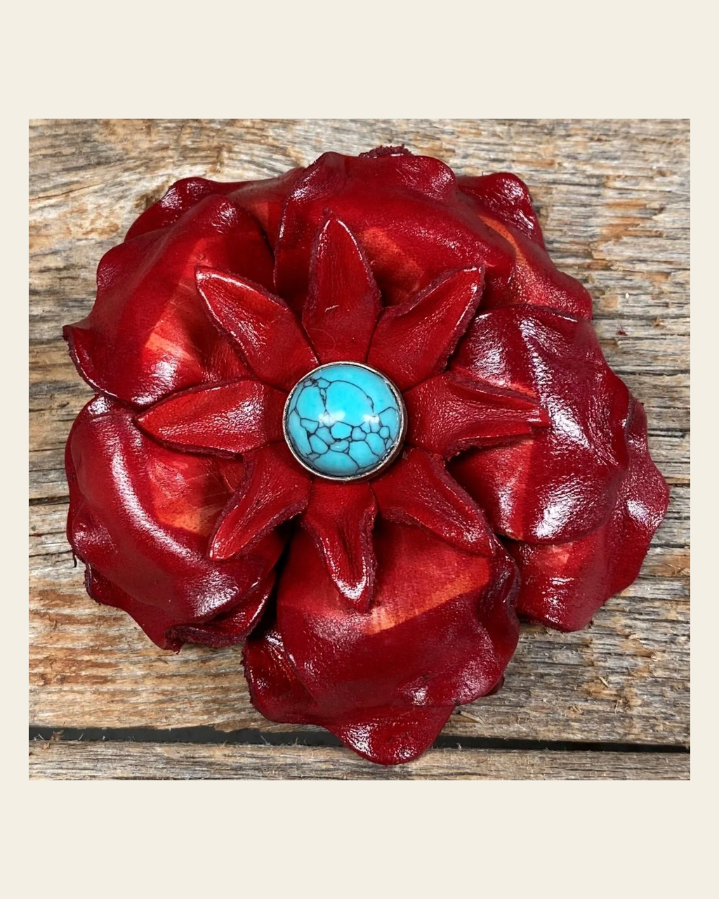 Red Gardenia Flower With Round Turquoise Cabochon on a warm cream background