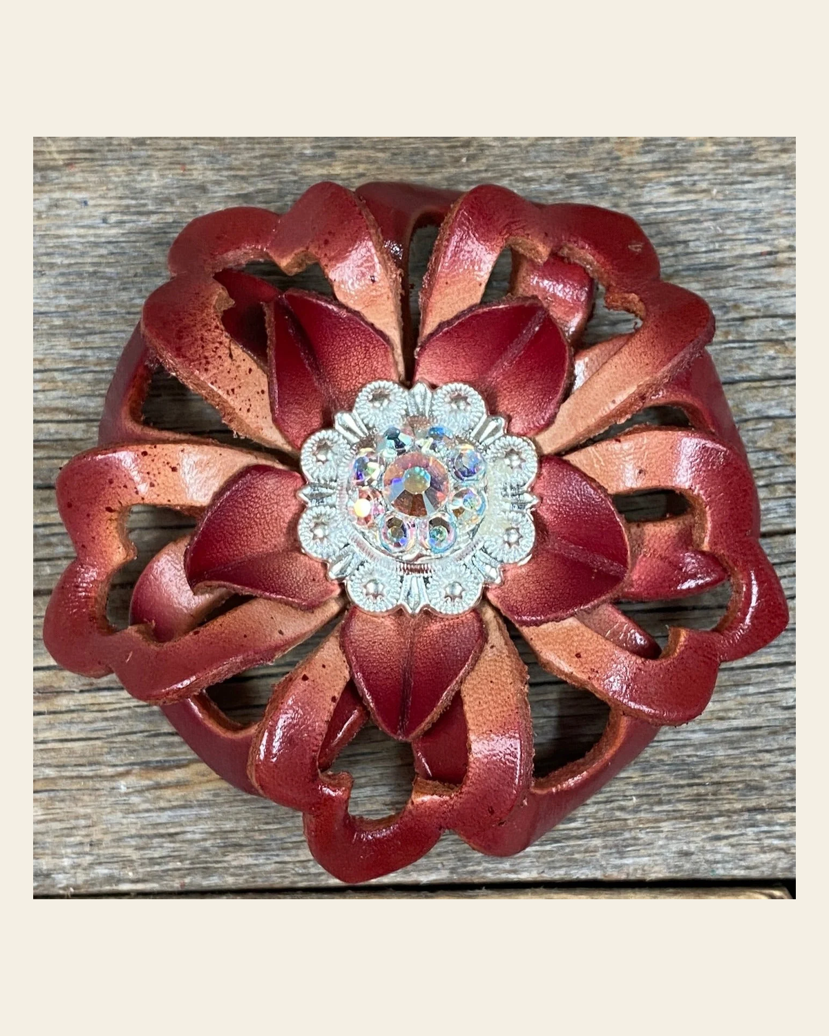 Red Lotus Flower With Bright Silver AB 1" Concho on a warm cream background