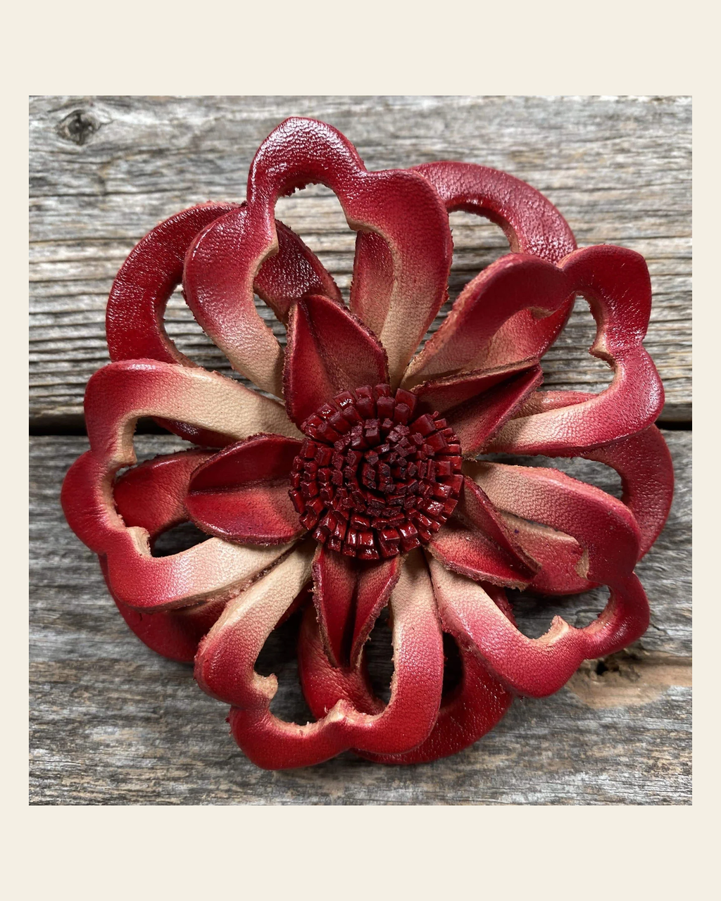 Red Lotus Leather Flower on a warm cream background