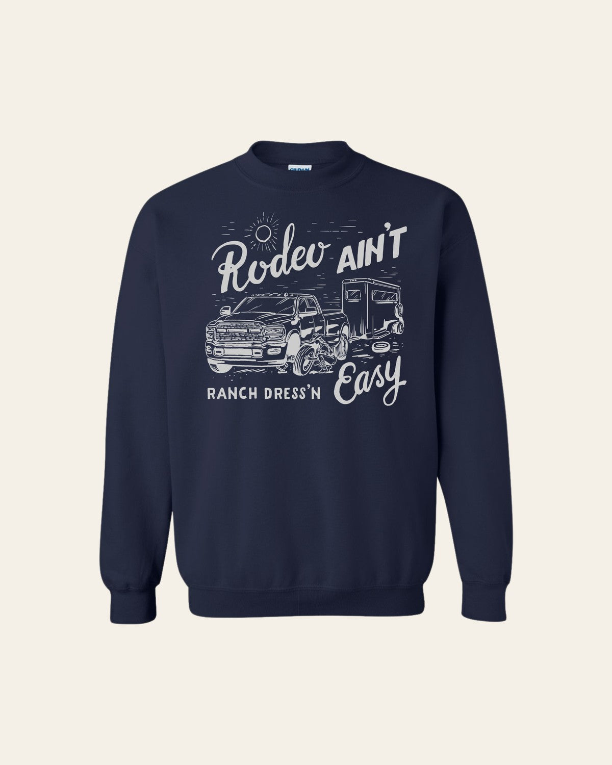Rodeo Ain't Easy Navy Crewneck on a warm cream background