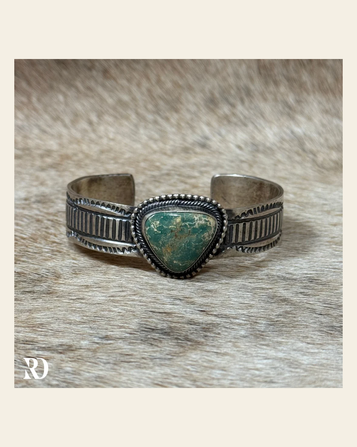 Royston Turquoise Cuff By Tillie John on a warm cream background