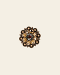 Ruby Jet & Champagne Copper 1.25" European Crystal Concho on a warm cream background