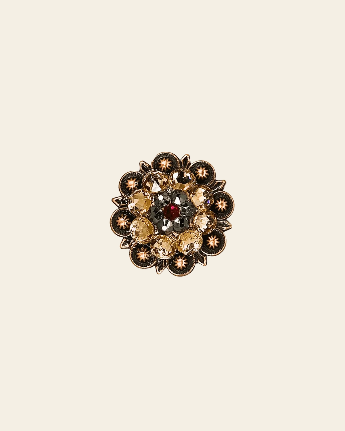 Ruby Jet & Champagne Copper 1.25" European Crystal Concho on a warm cream background