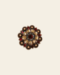 Ruby Jet & Champagne Copper 1.5" European Crystal Concho on a warm cream background