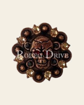 Ruby, Jet & Champagne Copper 1.75" Skull European Crystal Concho on a warm cream background