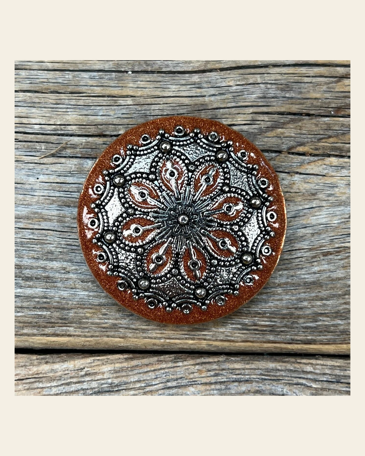 Rust Filigree and Dots Concho 1.5" W233L on a warm cream background