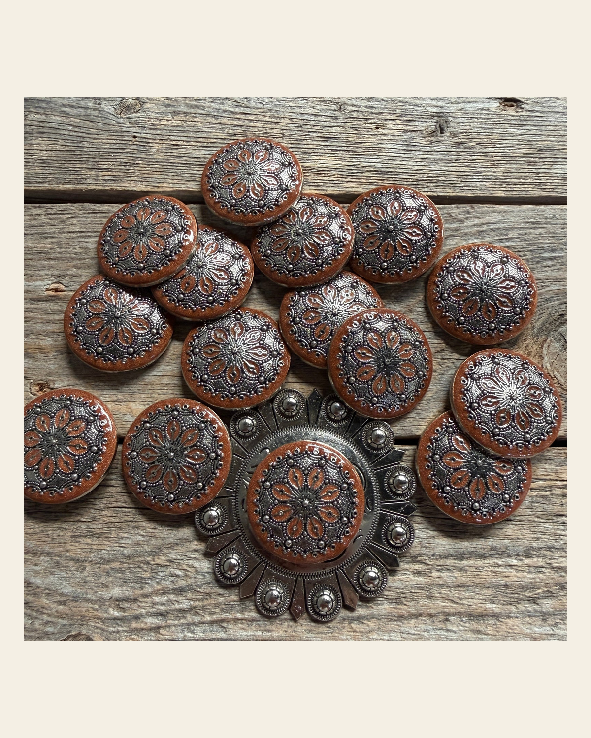 Rust Filigree and Dots Western Concho W233 on a warm cream background