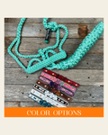 Rose - Turquoise Mule Tape Halter on a warm cream background