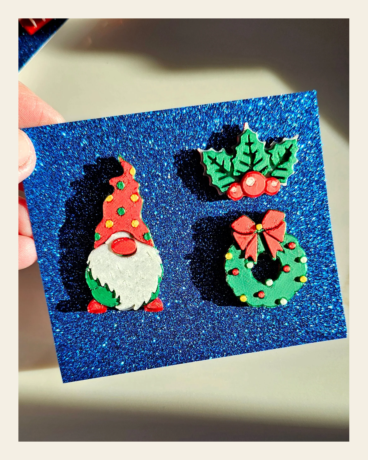 set of 3 Gnome Wreath Holly Hat Pins Christmas Made in America on a warm cream background