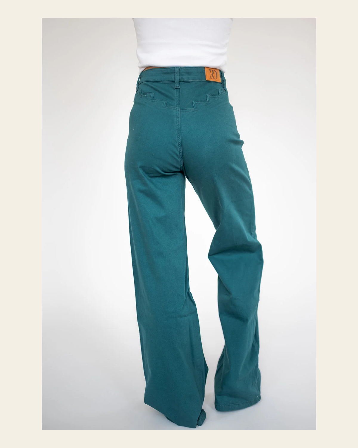 Shania Vintage - Teal on a warm cream background