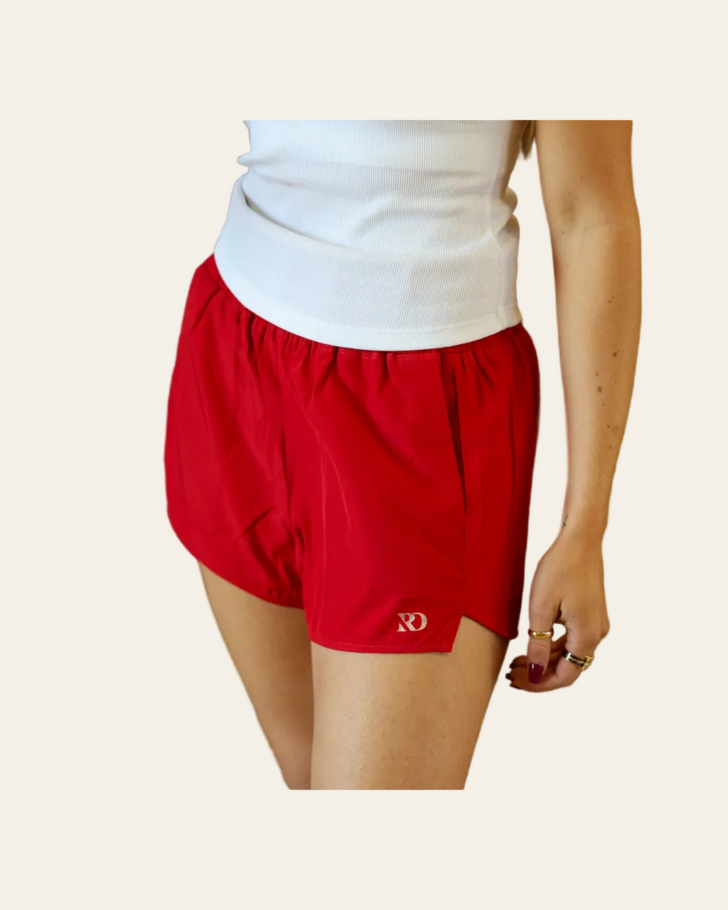 Essentials Shorts | Red on a warm cream background