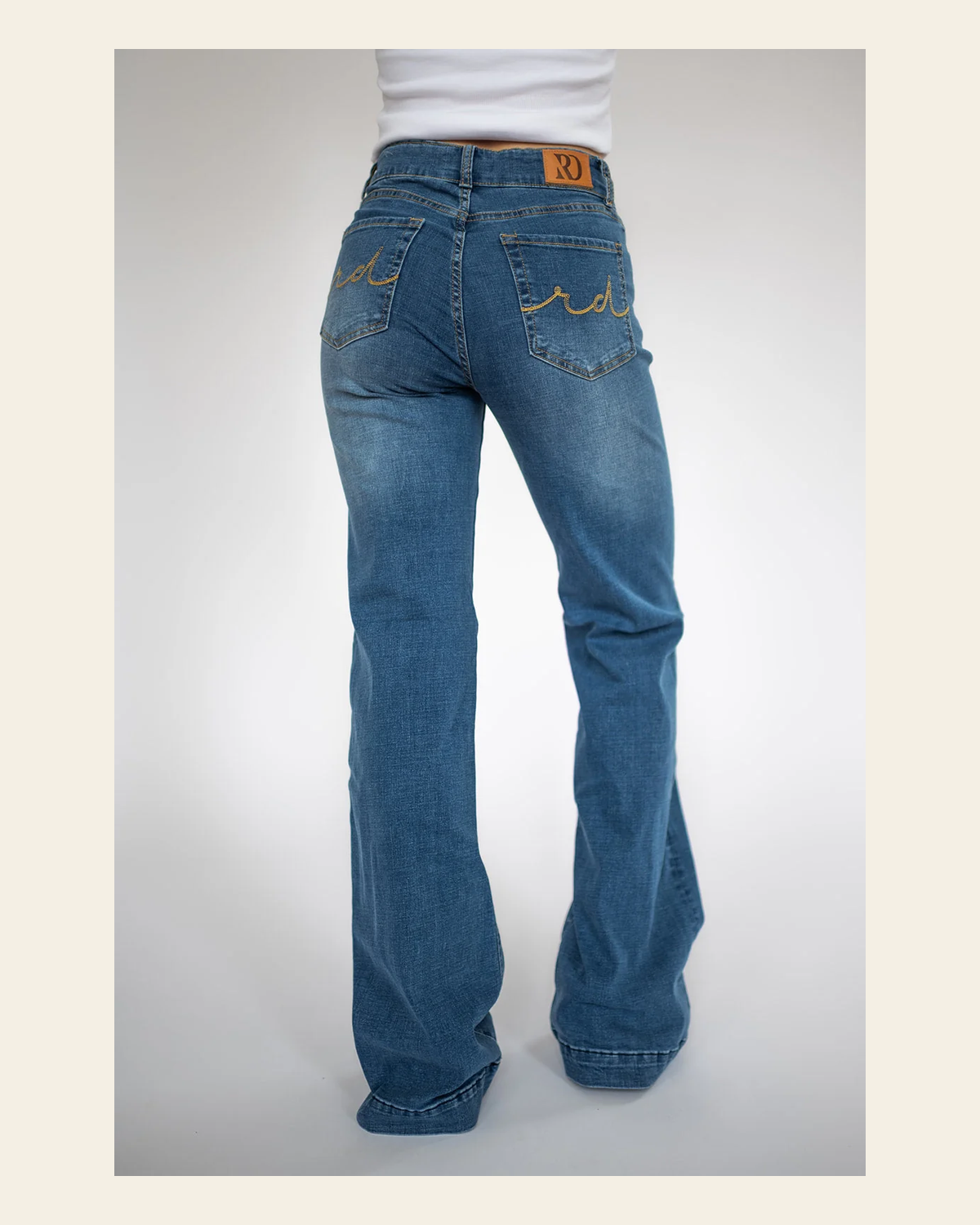 Signature Trouser Medium Wash on a warm cream background