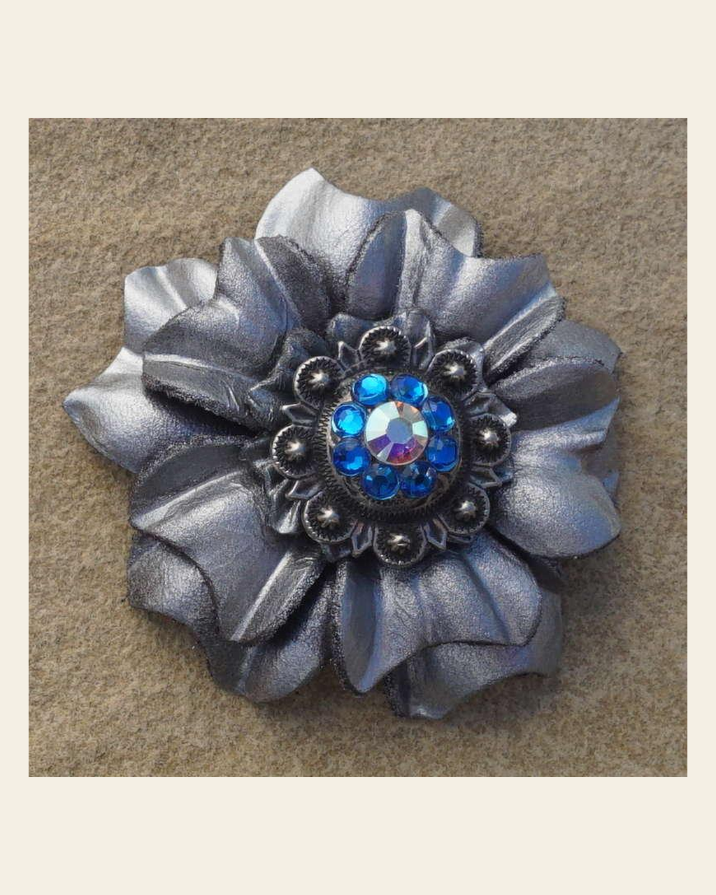 Silver Carnation Flower With Antique Silver Capri and AB 1" Concho on a warm cream background
