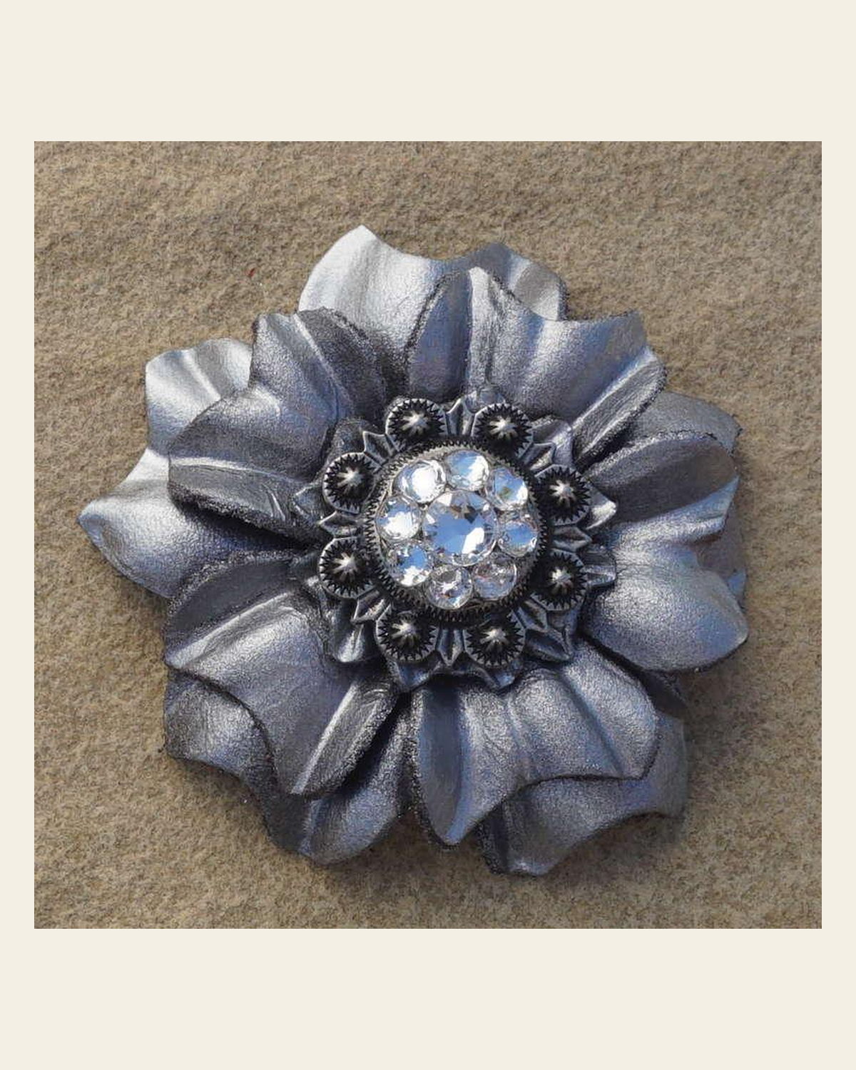 Silver Carnation Flower With Antique Silver Clear 1" Concho on a warm cream background