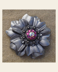 Silver Carnation Flower With Antique Silver Fuchsia and AB 1" Concho on a warm cream background