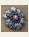 Silver Carnation Flower With Antique Silver Pink & AB 1" Concho on a warm cream background