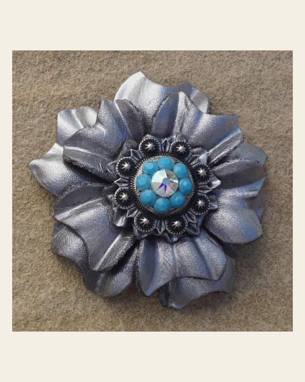 Silver Carnation Flower With Antique Silver Turquoise & AB 1" Concho on a warm cream background