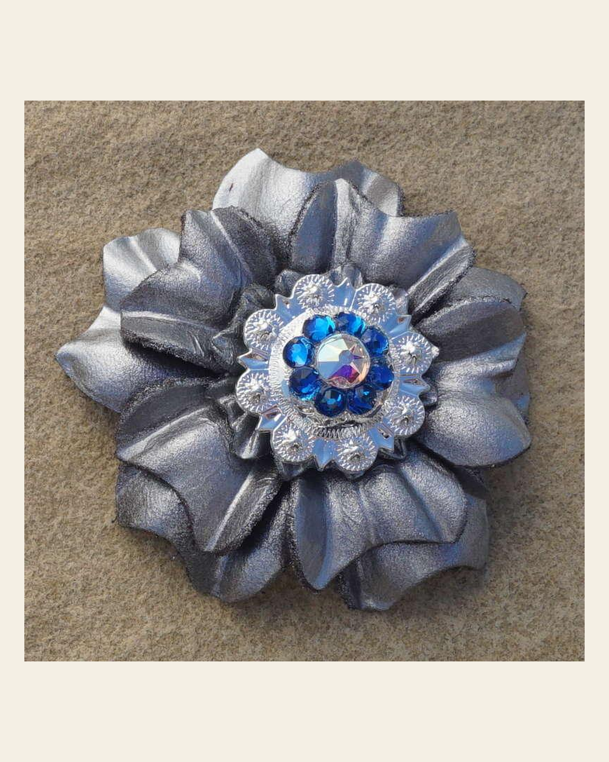 Silver Carnation Flower With Bright Silver Capri and AB 1" Concho on a warm cream background