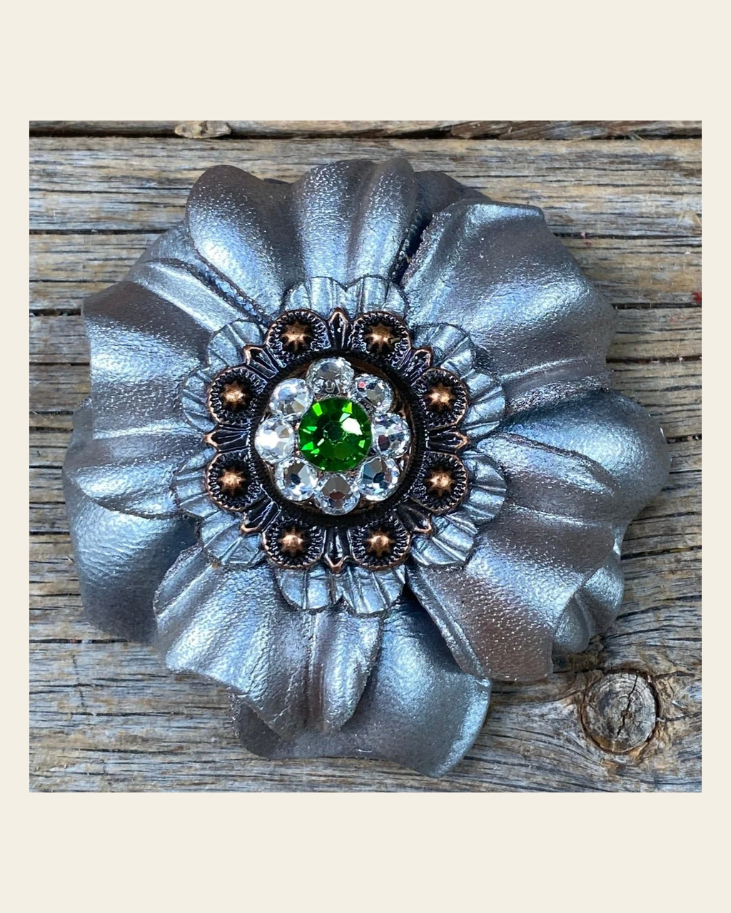Silver Carnation Flower With Copper Fern, Clear 1" Concho on a warm cream background
