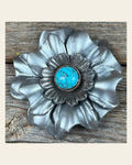 Silver Carnation Flower With Round Turquoise Cabochon on a warm cream background