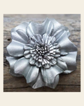 Silver Carnation Leather Flower on a warm cream background